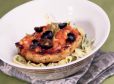Schweinskotelett mit schwarzen Oliven