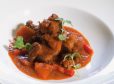 Schweinswadlgulasch mit Paradeisern