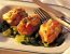 Schweinsmedaillons mit Paradeisern und Edelschimmelkäse überbacken