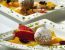 Polenta-Obst-Knödel in Pistazienbröseln mit Gewürzorangenragout