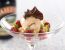Bananen und Himbeeren in Baileys Original mit Schokoladeneis und Apfelsinen