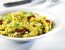Girandole al Pesto alla Genovese mit getrockneten Tomaten, frisch geriebenem Schafskäse und Rucola