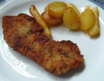 Schweinsschnitzel in Kräuterpanier